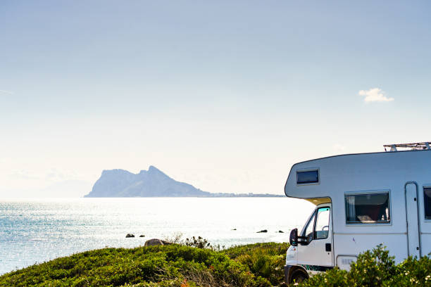istock Caravan on spanish coast, Gibraltar rock on horizon 1249964551
