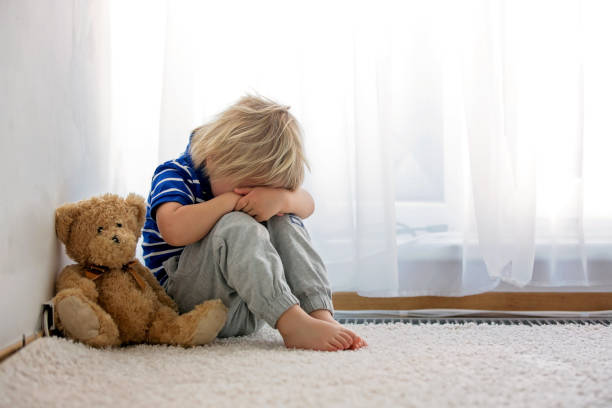 istock Child, toddler boy, punished in the corner for making mischieves 1249964684