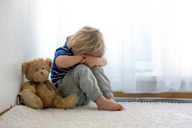 istock Child, toddler boy, punished in the corner for mischieves 1249964829
