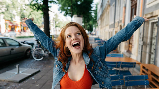 istock Happy vivacious young woman celebrating 1249965085