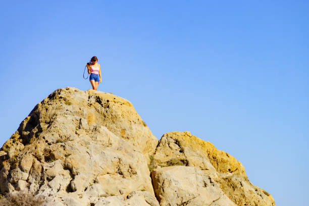 istock Woman with camera take travel photo 1249965807