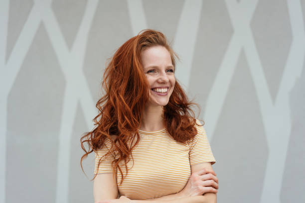 istock Happy young woman smiling in delight 1249966701