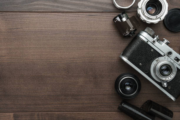 istock retro film camera and some lenses 1249969104