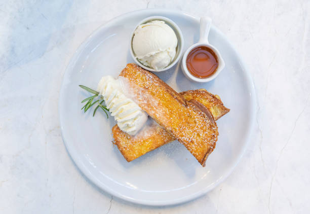 istock French Toast with Maple Syrup, Ice-cream and Whipped cream 1249969171