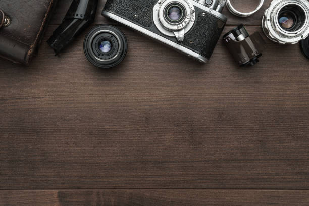 istock retro film camera and some lenses 1249969265