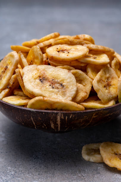 istock Healthy snack, crispy dehydrated unsugared banana chips in bowl 1249970551