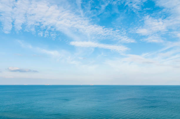 Seaside panorama. Minimalistic background with sea and deep blue sky