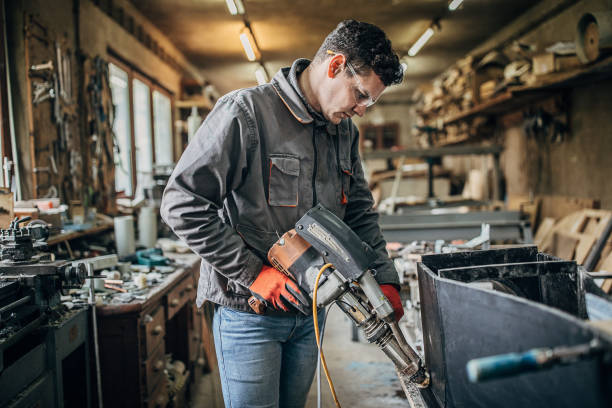istock Young craftsman welding parshall flumes in workshop 1249977811