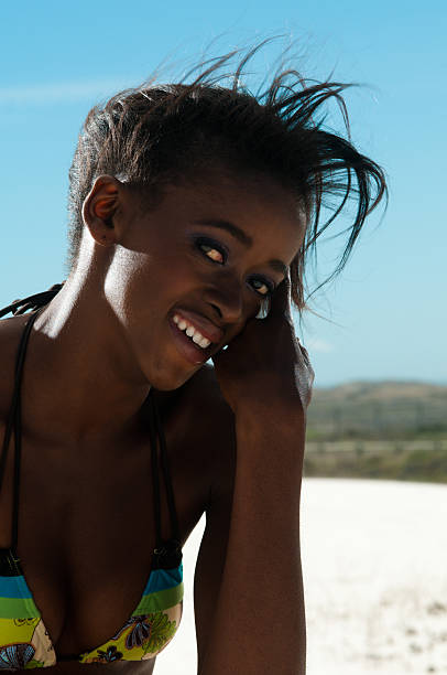 istock Young woman in swimsuit on beach 124997807