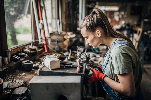 istock Woman fixing plexiglass products in workshop 1249978098