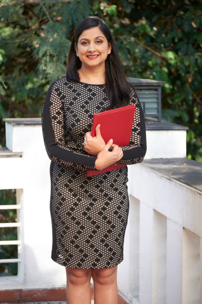istock Modern Businesswoman Outdoors Portrait 1249978102