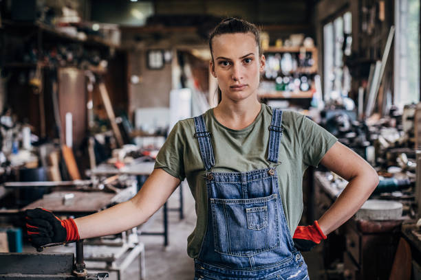 istock One young woman standing in workshop 1249978413