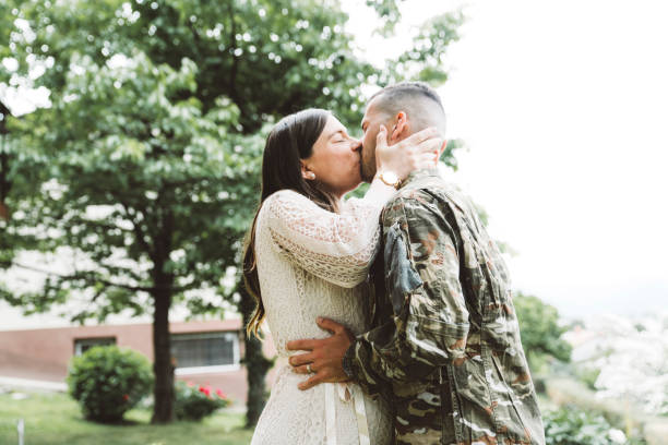 istock Soldier kissing his wife 1249986004
