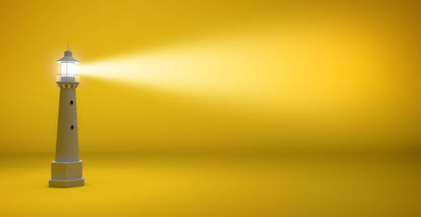 lighthouse in yellow background light beam of a lighthouse isolated on a yellow background with copy space Beacon stock pictures, royalty-free photos & images