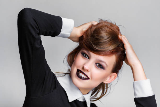 istock Young and beautiful girl with dark makeup. 1249987643