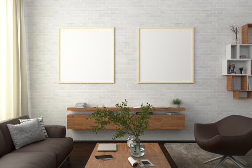 Two square blank posters on white brick wall in interior of modern living room with clipping path around poster. 3d illustration