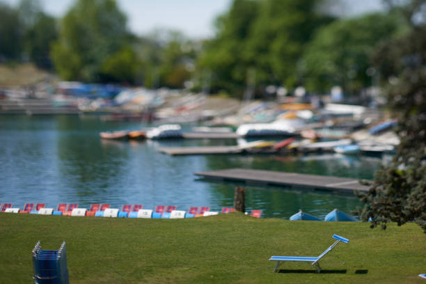 activities on the lake with canoes in tilt shift