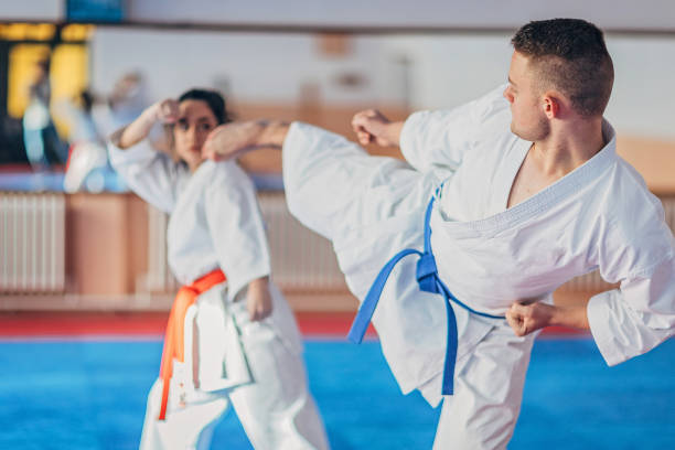 istock Two young karate students training karate in gym 1249993069