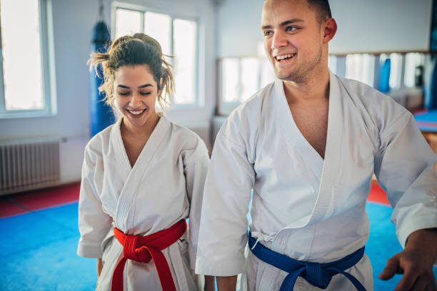 istock Two young karate students standing in gym 1249994412