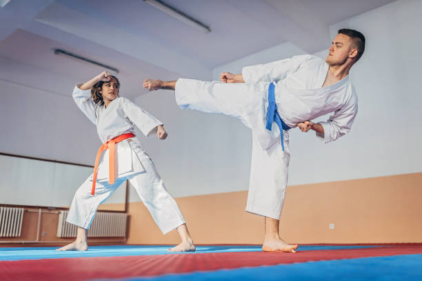 istock Man and woman training karate together 1249997008