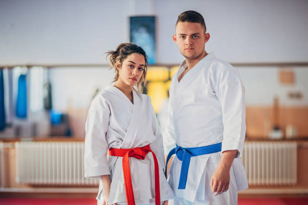 istock Karate students standing in gym 1249998195