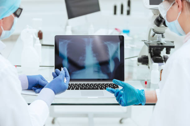 istock close up. doctors discussing an x-ray of the lungs 1250002001