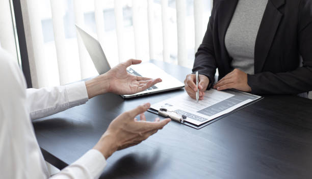 istock Midsection Of Manager Interviewing Candidate In Office 1250002180