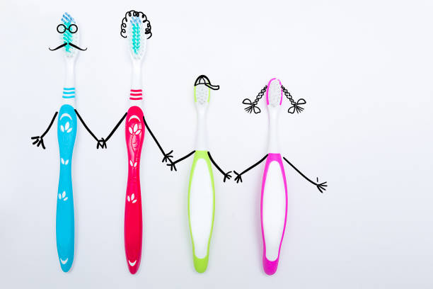 Toothbrushes on neutral background. Family hygiene concept.