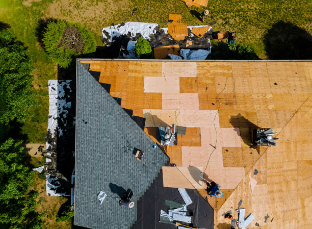 istock Home with roof replacing new shingles, felt paper, and tools 1250006723