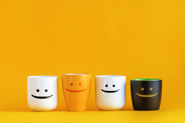 Coffee Cups with Happy Emoticons Coffee Cups with Happy Emoticons - Conceptual Image for Business Team Coffee Break with Copy Space decaffeinated photos stock pictures, royalty-free photos & images