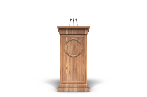 A wooden speech lecturn podium with a microphone on an isolated white studio background - 3D render