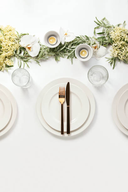 istock Wedding dinner table setting decorated with fresh flowers and greenery 1250016890