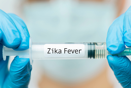 Doctor showing Zika Fever Vaccine.