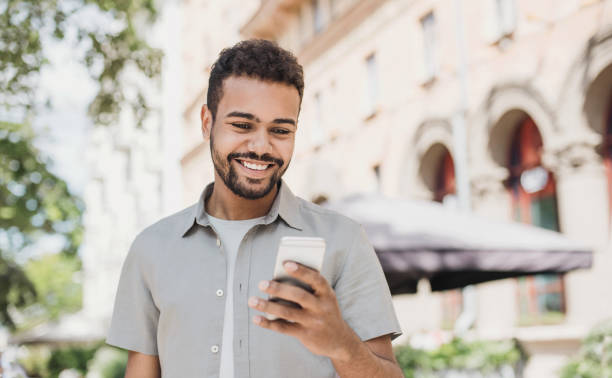 istock Handsome young man using smart phone in a city 1250017870