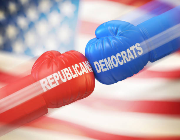 democrats vs. republicans. two boxing gloves against each other in colors of democratic and republican party - opposition party imagens e fotografias de stock