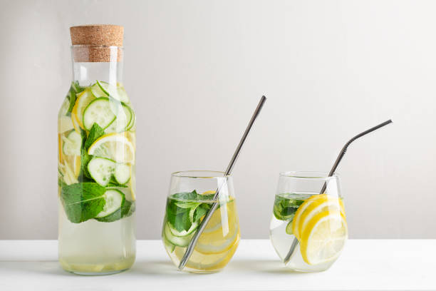 istock Rejuvenating drink, cocktail, water with lemon, ginger, mint, cucumber on a white background. 1250022945