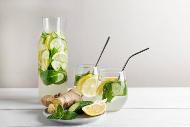 istock Rejuvenating drink, cocktail, water with lemon, ginger, mint, cucumber on a white background. 1250023483
