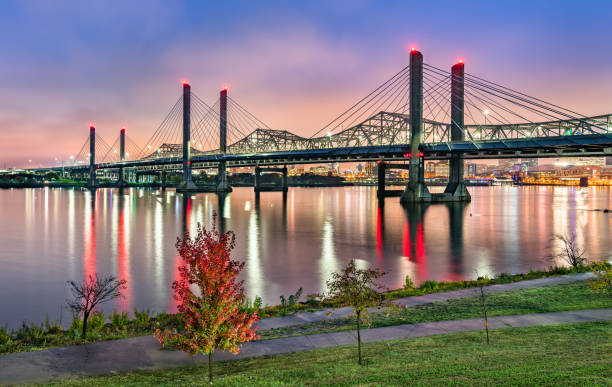 Bridges across the Ohio River between Louisville, Kentucky and Jeffersonville, Indiana The Abraham Lincoln Bridge and the John F. Kennedy Memorial Bridge across the Ohio River between Louisville, Kentucky and Jeffersonville, Indiana indiana photos stock pictures, royalty-free photos & images