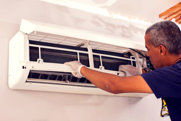 istock Man worker fixing air conditioning on the wall. 1250025168