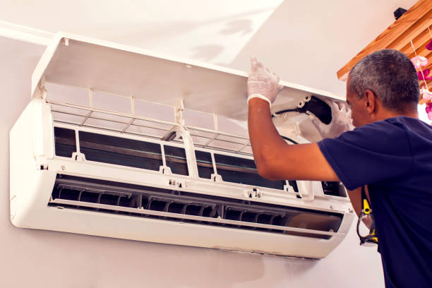 istock Man worker fixing air conditioning on the wall. 1250025190