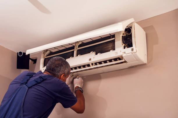 istock Man worker doing cleaning of air conditioning. 1250025216