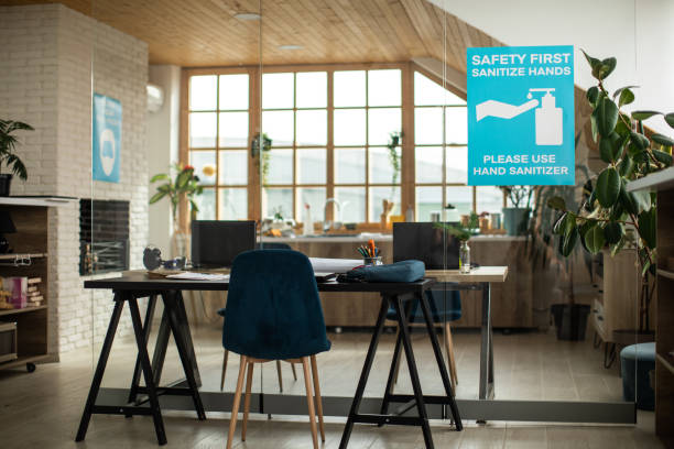 istock Modern office with poster about covid-19 illness prevention and safety 1250025532