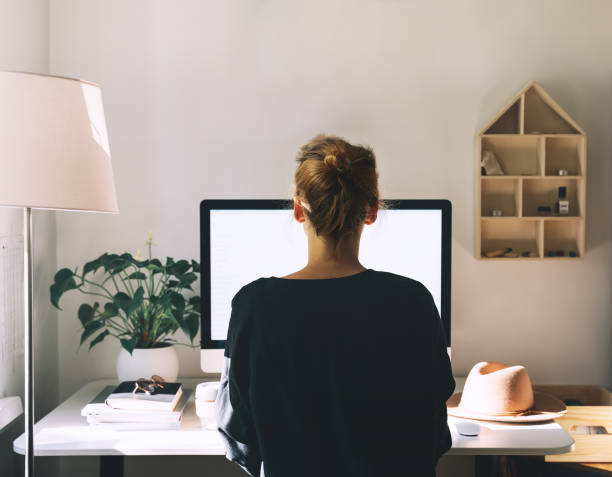 istock Woman working on computer at home office. Workplace, desk of creative worker. 1250027035