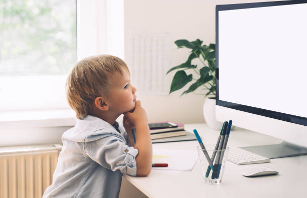 istock Preschool child using computer technology in early development or entertainment at home. 1250027082
