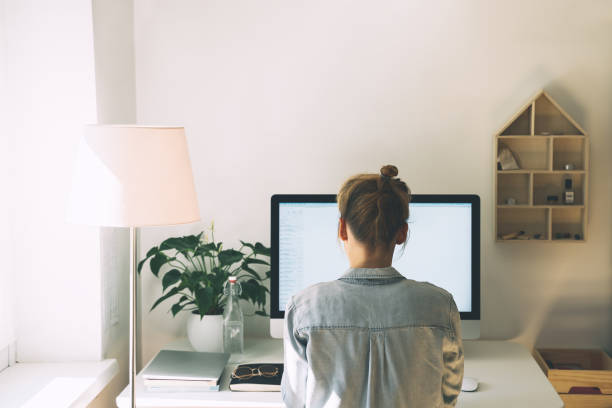 istock Woman working on computer at home office. Workplace, desk of creative worker. 1250027083