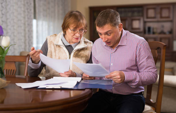 istock Woman with son filling out documents 1250029475