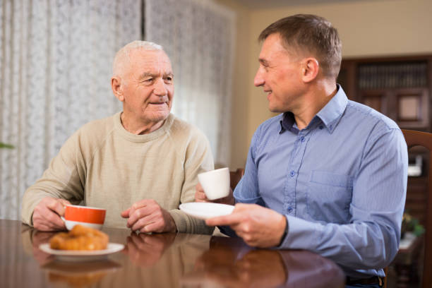 istock Elderly man talking with adult son 1250029511