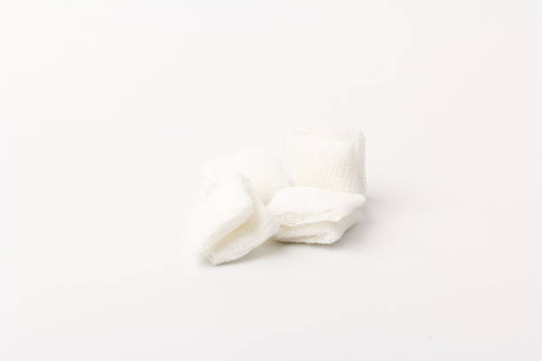 istock White gauze pads on white background. Materials for dental surgery. Close up 1250030977