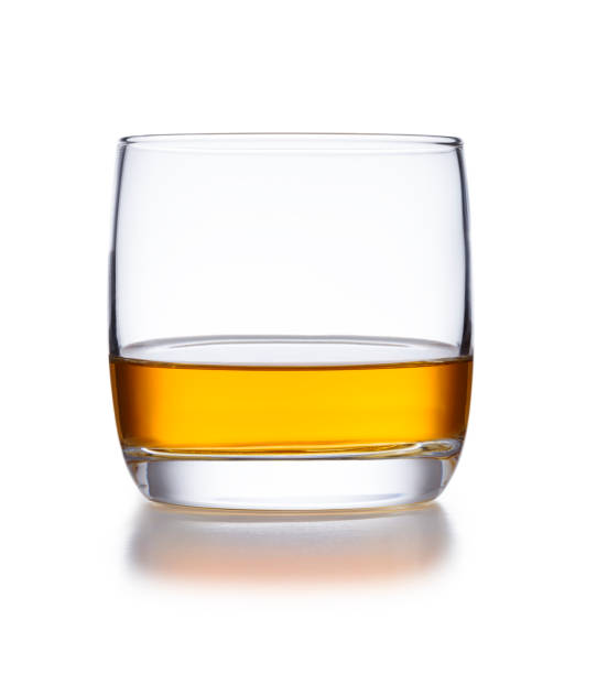a isolated bowl style glass of whisky, shot on white - brandy bottle alcohol studio shot imagens e fotografias de stock