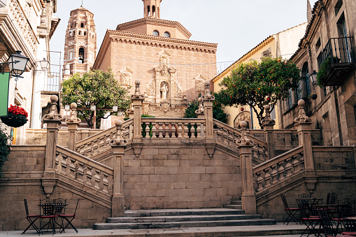 Staircase leading to Cathedral of St. James in the city of Santiago de Compostela in Galicia, against the tower of church of Santa Maria in city of Utebo, Torre del Utebo, Poble Espanyol, Barcelona